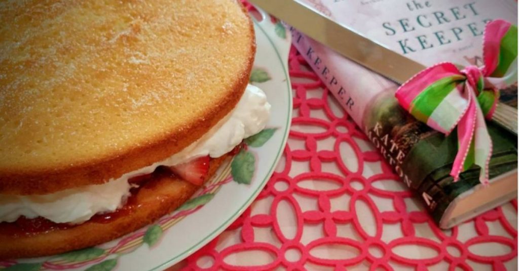 Victoria Sponge Cake, a cake knife and the book