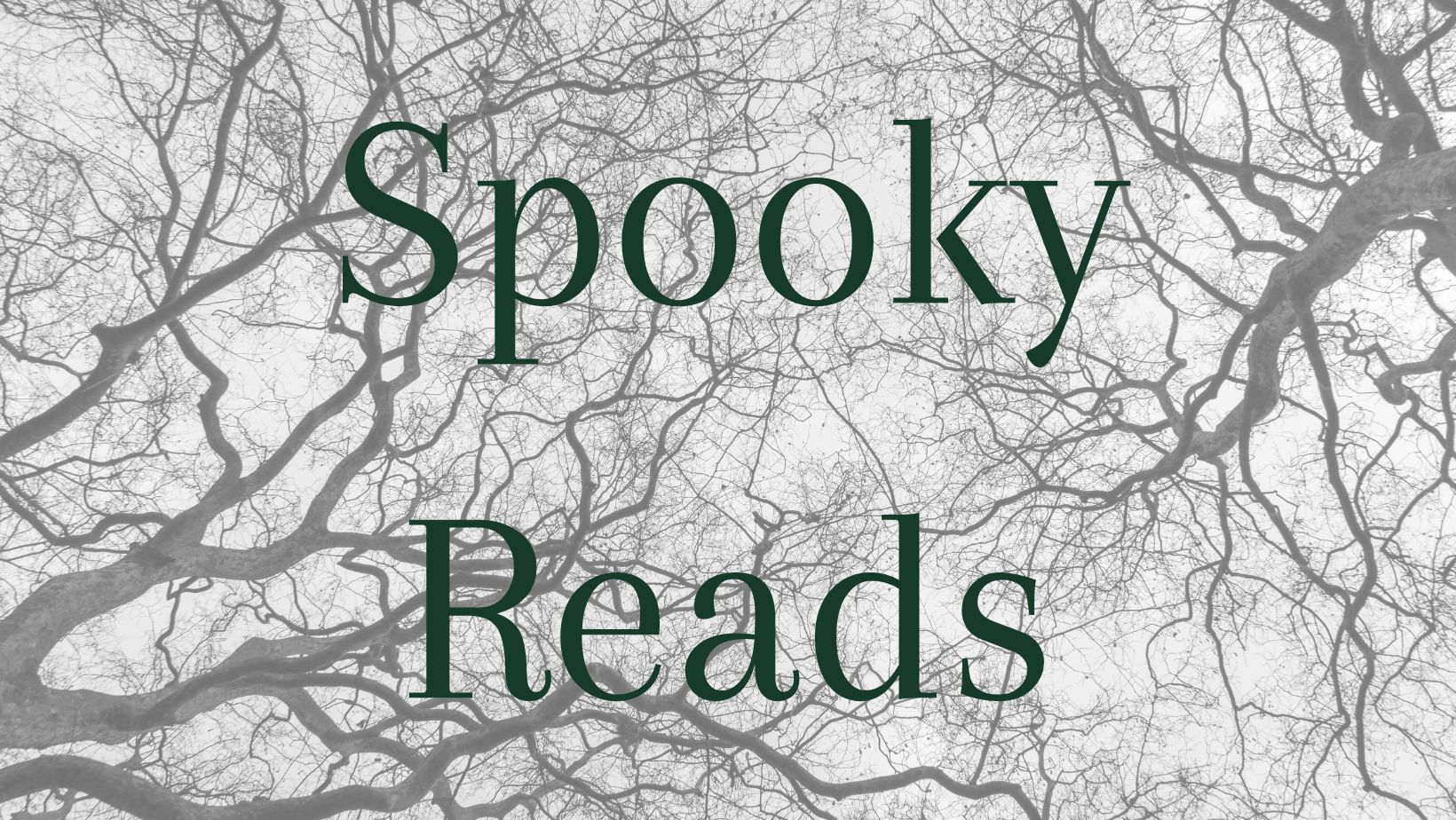 the title spooky reads in front of a black and white picture of creepy tree branches